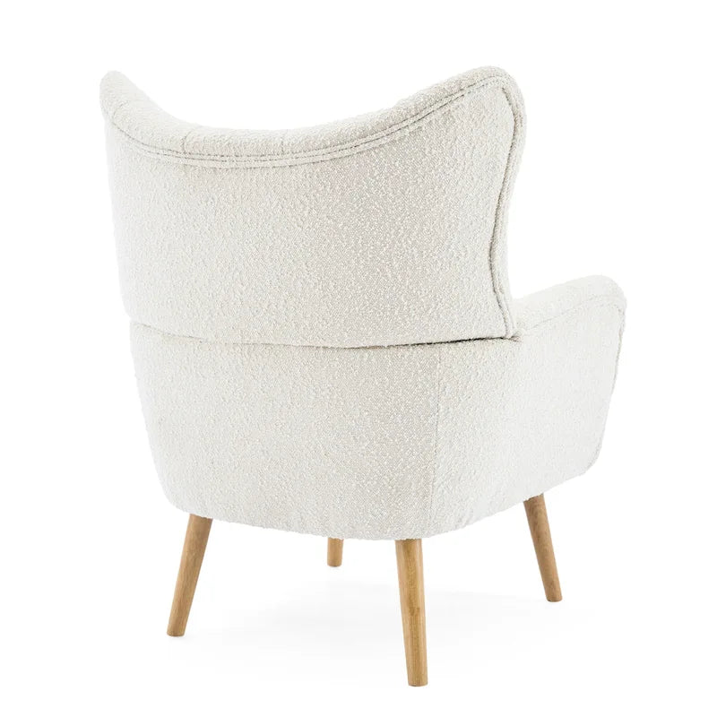 Fauteuil club à oreilles en boucle Amande, une place