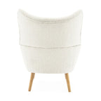 Fauteuil club à oreilles en boucle Amande, une place