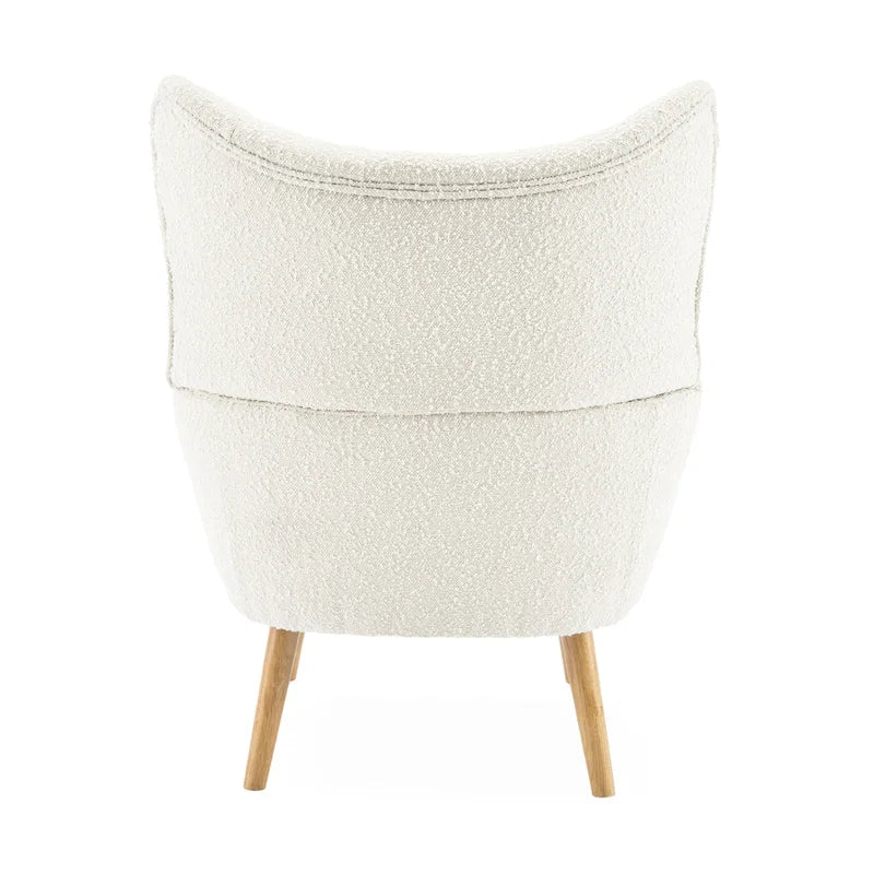 Fauteuil club à oreilles en boucle Amande, une place