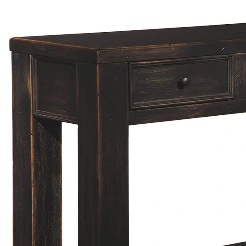 Table basse en bois avec quatre tiroirs et une étagère, noir vieilli