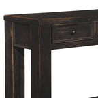 Table basse en bois avec quatre tiroirs et une étagère, noir vieilli