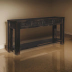 Table basse en bois avec quatre tiroirs et une étagère, noir vieilli